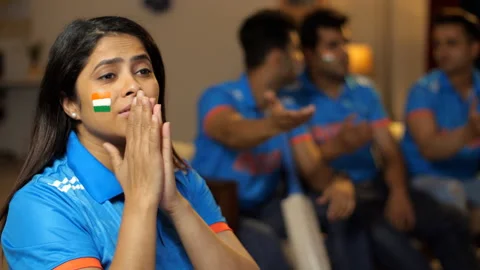 cricket-fans-watching-live-match-footage-253140610_iconl